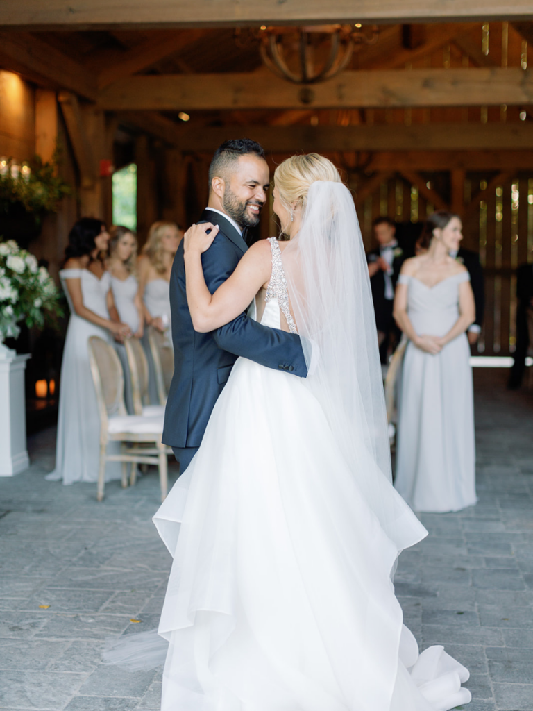 Bride and groom sharing their first dance as newlyweds in Langdon Hall's Summer House 