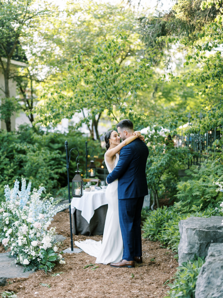 The couple sharing their first dance as newlyweds in the gardens of Langdon Hall 