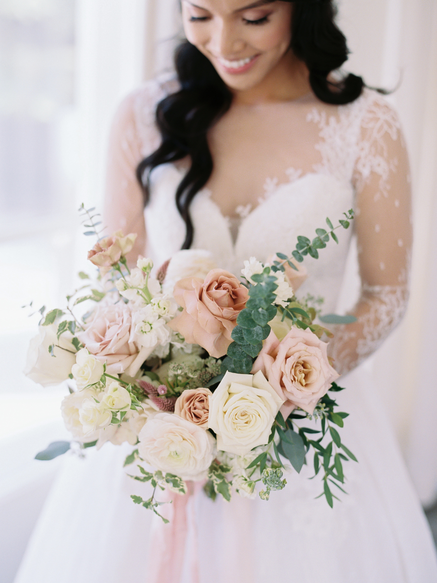 Romantic bridal bouquet with quicksand roses, cappuccino roses, blush ranunculus, mocha lisianthus, playa blanca roses