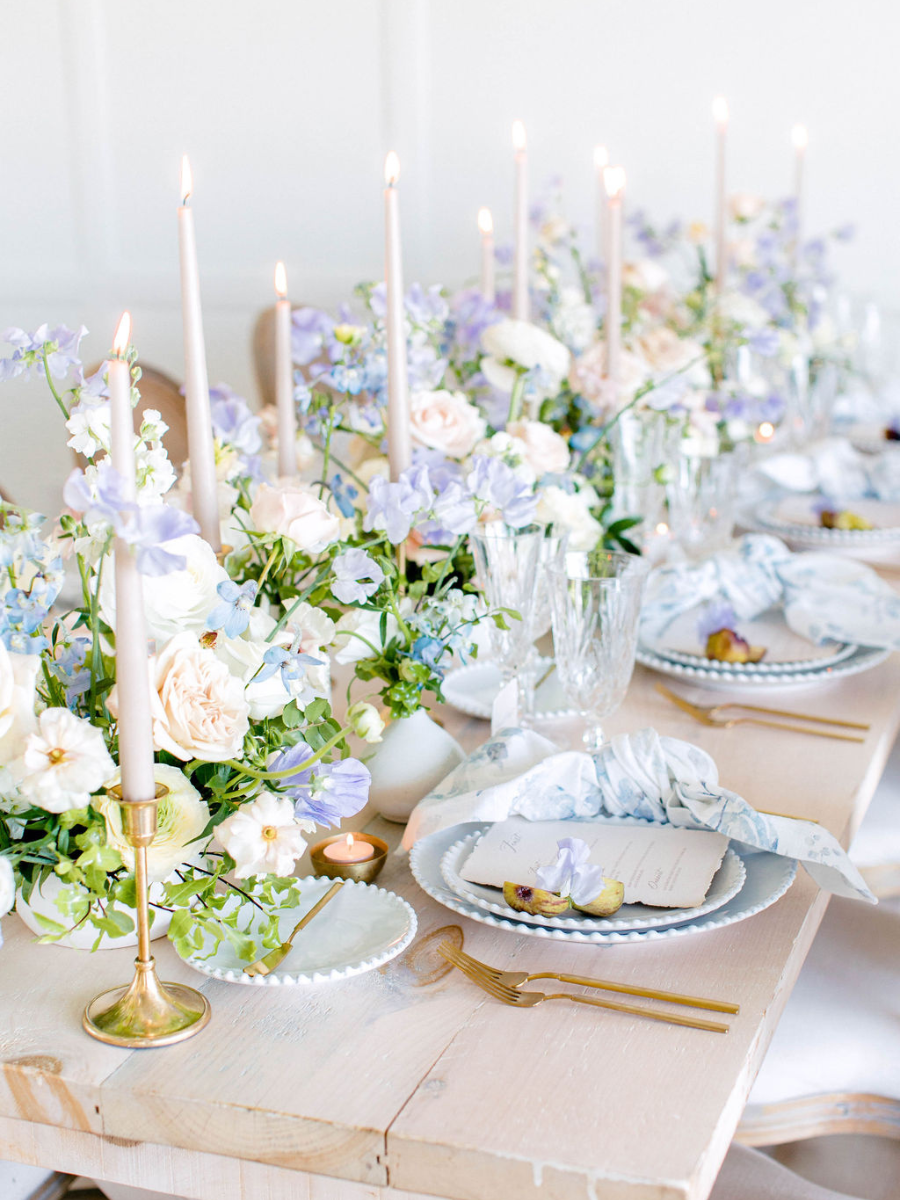 Tablescape with lots of flowers, lit candles and place settings Romantic Branding Shoot for Beth Jacobs Wedding & Events