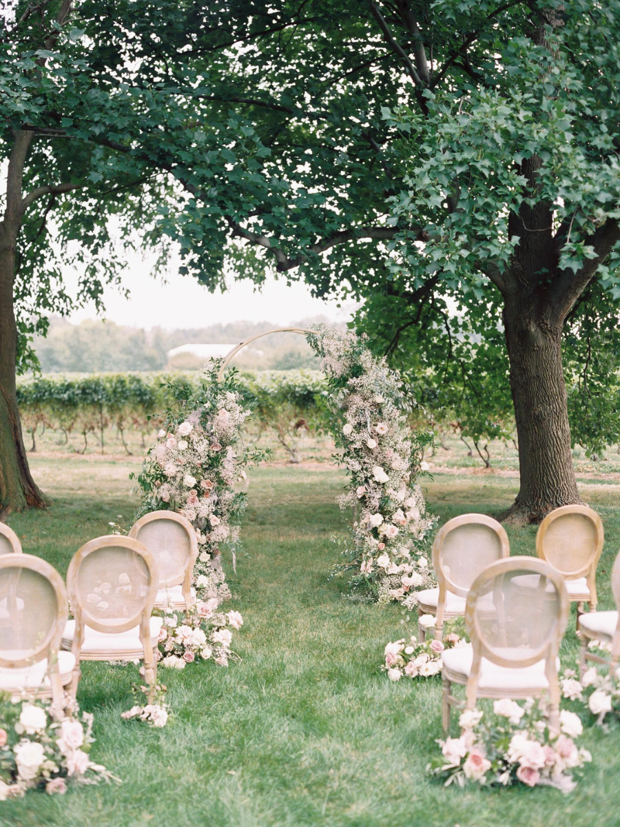 Finished floral arch with guest chairs and more floral arrangements Katie Nicolle's Photography Workshop