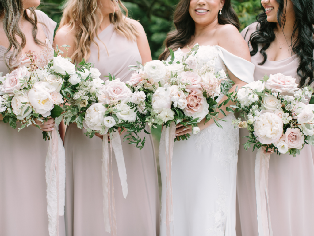 Bride with her Bridesmaids holding their bouquets