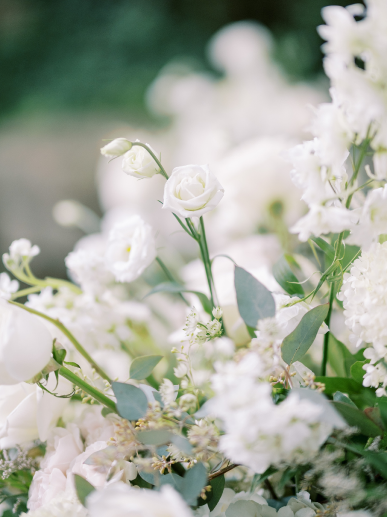 Close up of the white florals with lush greenery, lush garden style