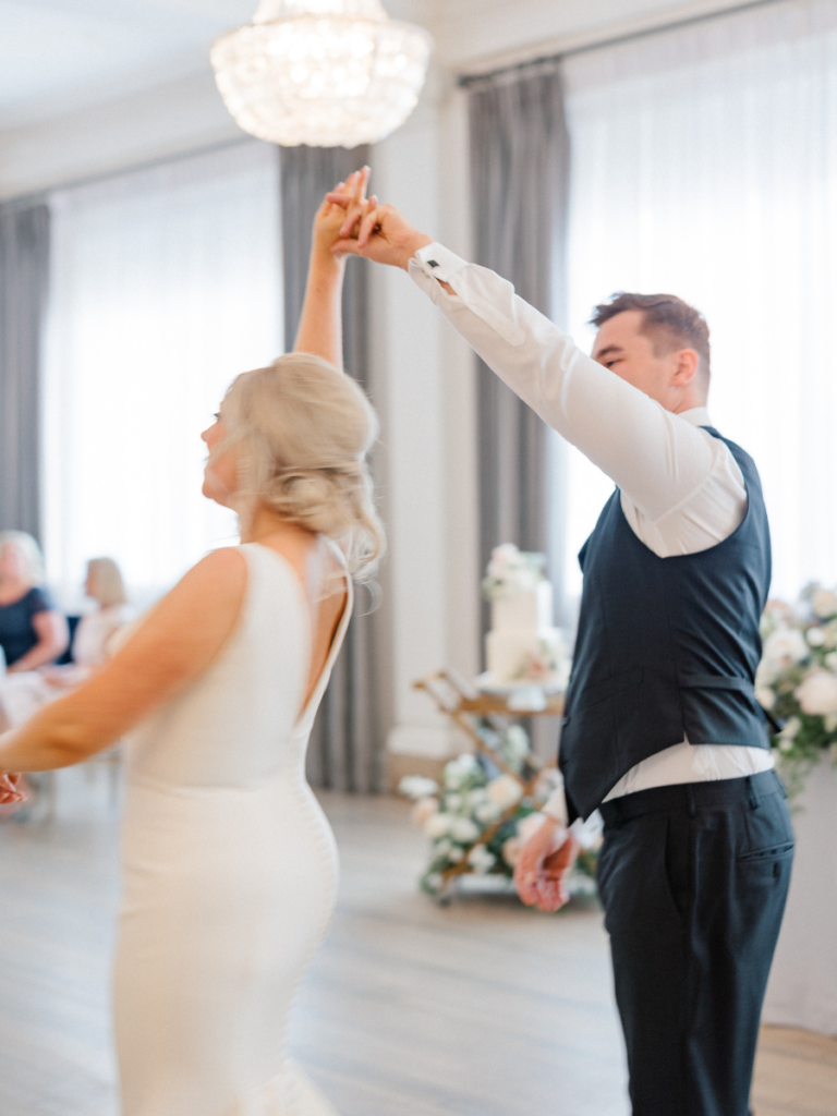 Bride and groom sharing their first dance as newlyweds at The Walper Hotel 