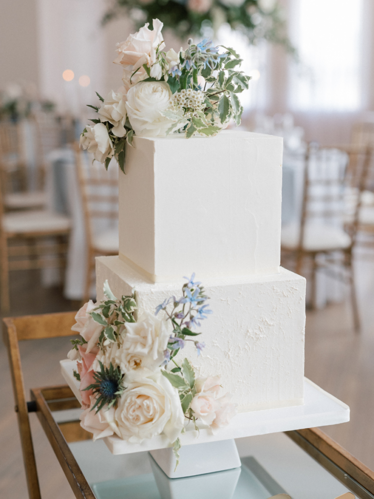 White wedding cake with floral accents 