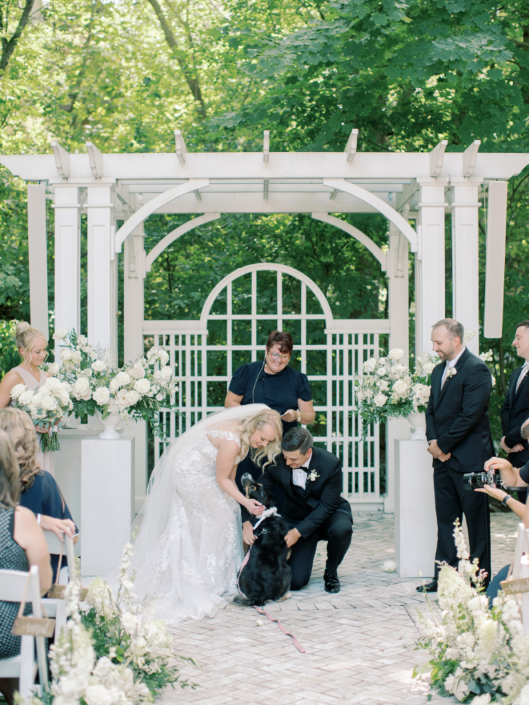 Bride and groom with their dog at the alter