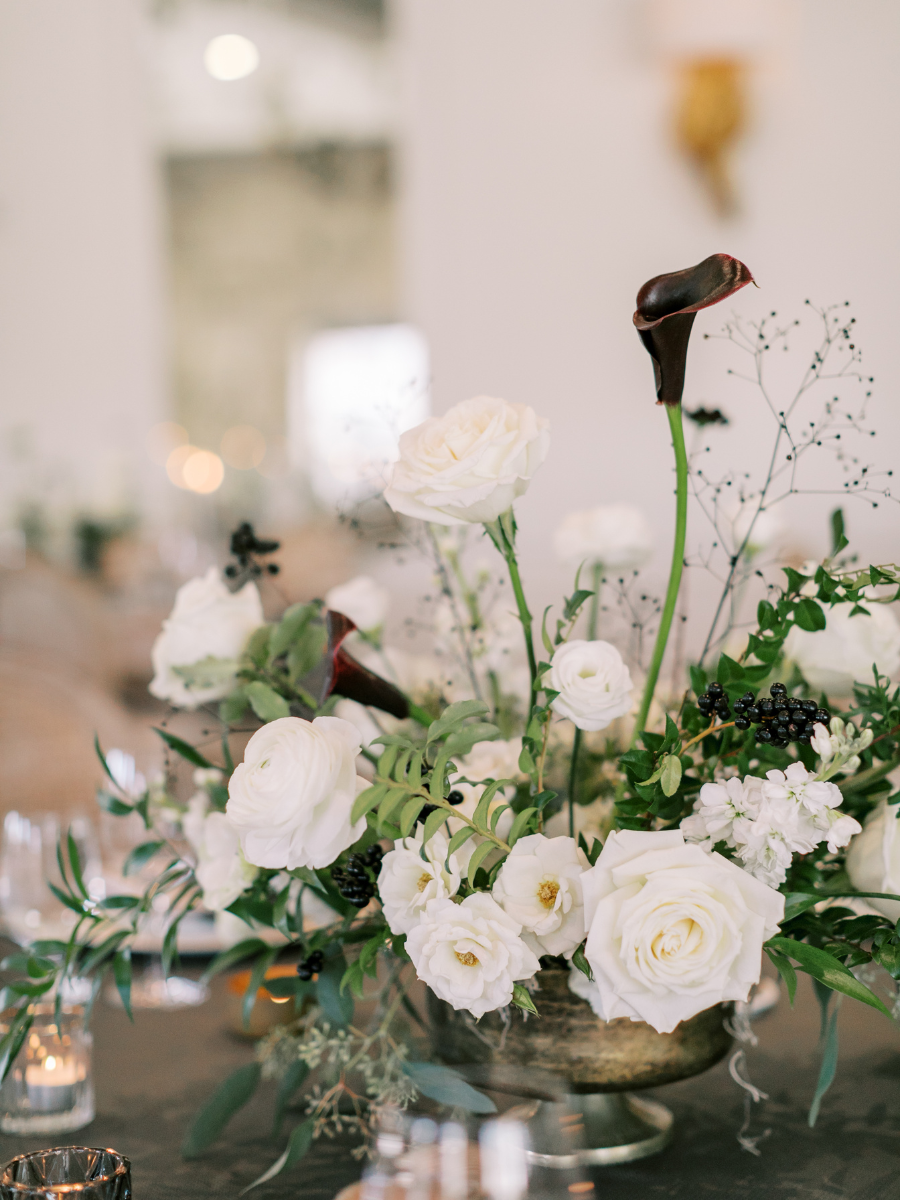 Modern floral arrangement with white and black flowers